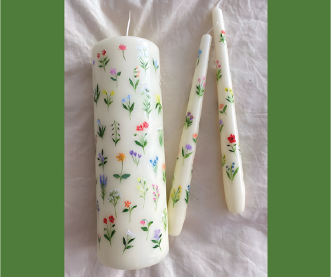 Candles decorated with painted designs