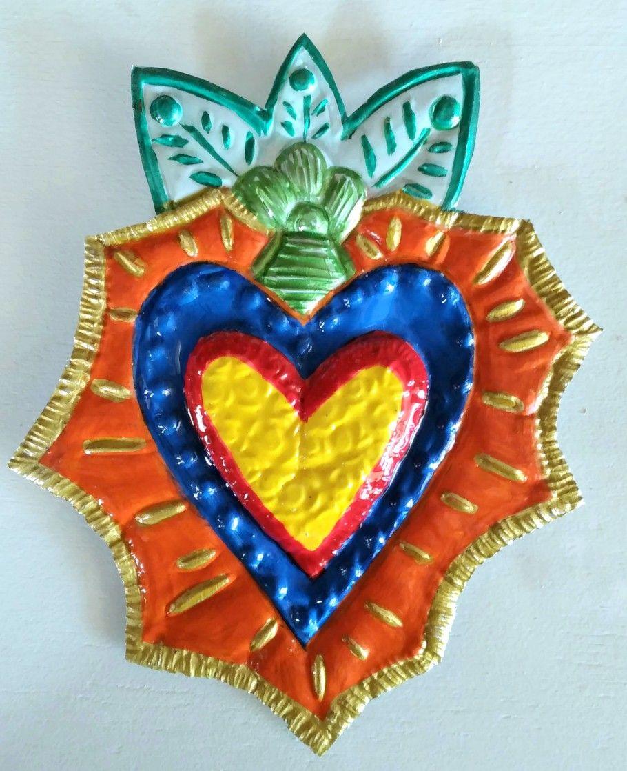 Heart decoration using embossing / repusado technique. 