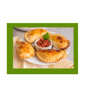 Plate of Empanadas with bowl of sauce. 