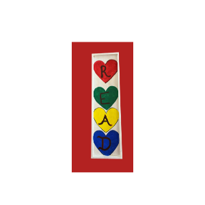 Wooden sign with the word "read" in hearts painted on it. 